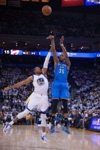 January 5, 2015; Oakland, CA, USA; Oklahoma City Thunder forward Kevin Durant (35) shoots the basketball against Golden State Warriors guard Andre Iguodala (9) during the first quarter at Oracle Arena. Mandatory Credit: Kyle Terada-USA TODAY Sports