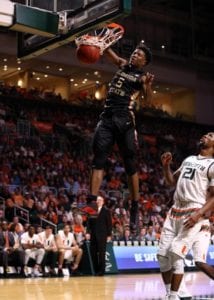 Jan 9, 2016; Coral Gables, FL, USA; Florida State Seminoles guard Malik Beasley (5) dunks the ball past Miami Hurricanes forward Kamari Murphy (21) during the first half at BankUnited Center. Mandatory Credit: Steve Mitchell-USA TODAY Sports