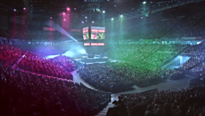 Massive crowd cheering inside arena during Nintendo eSports tournament.