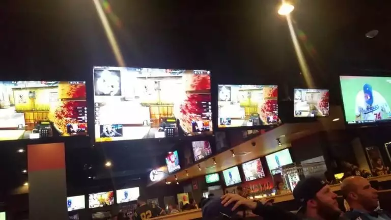 Customers enjoying food and eSports at Buffalo Wild Wings.