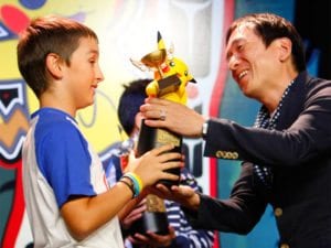 Child Pokemon Trainer get TPCI trophy