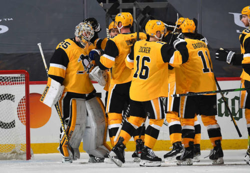 The Pittsburgh Penguins celebrate a game 2 victory over the Islanders