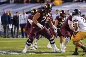 Daniel Faalele dropping back to pass block